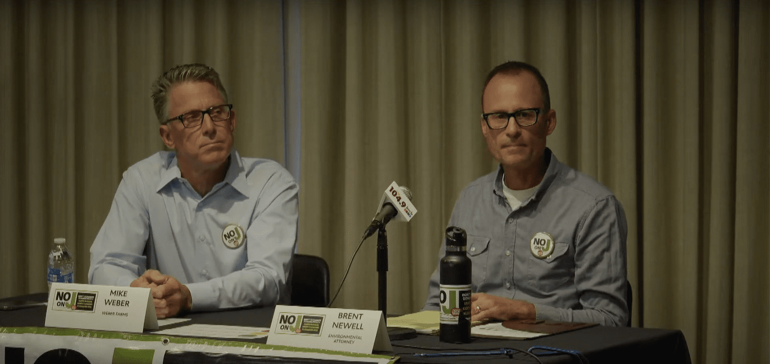 Mike Weber and Brent Newell speaking in opposition at the Measure J debate